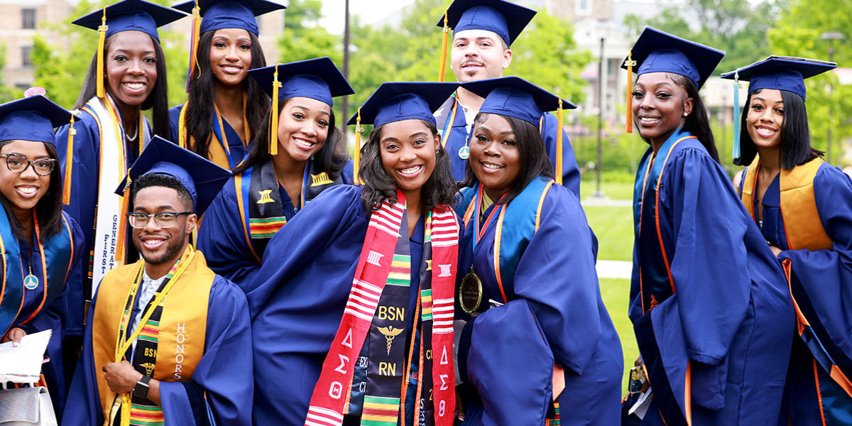 smiling students at graduation