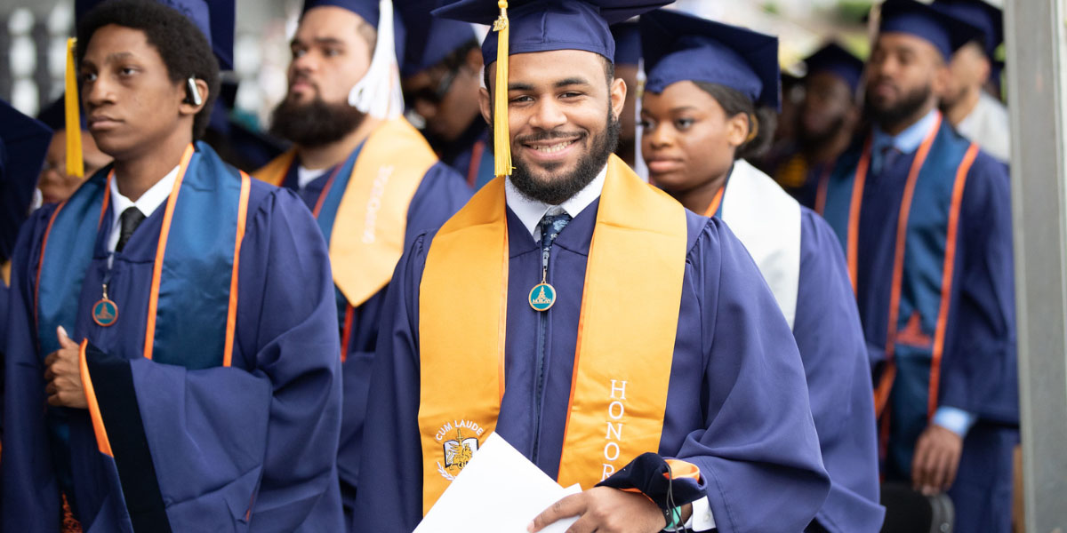 smiling male graduating student