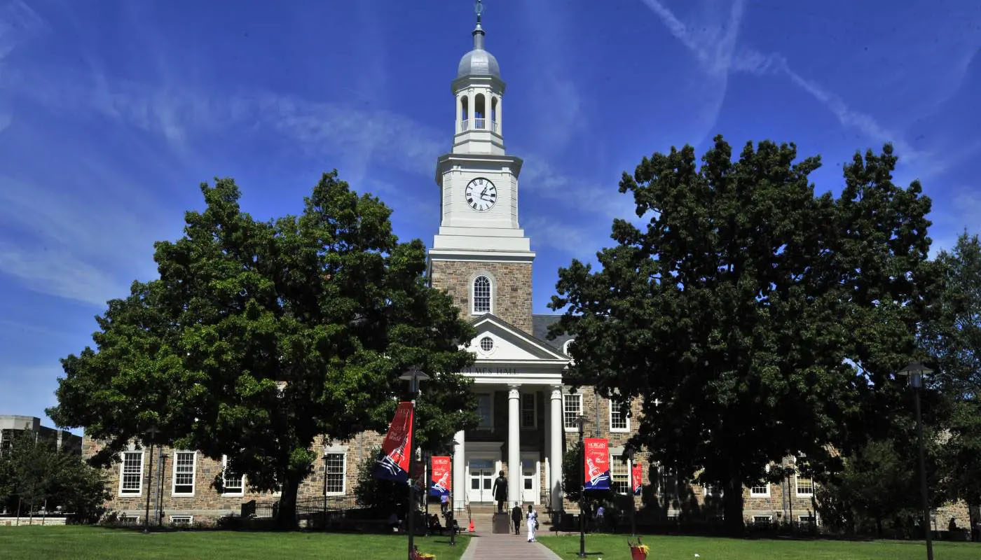 Holmes Hall within the trees